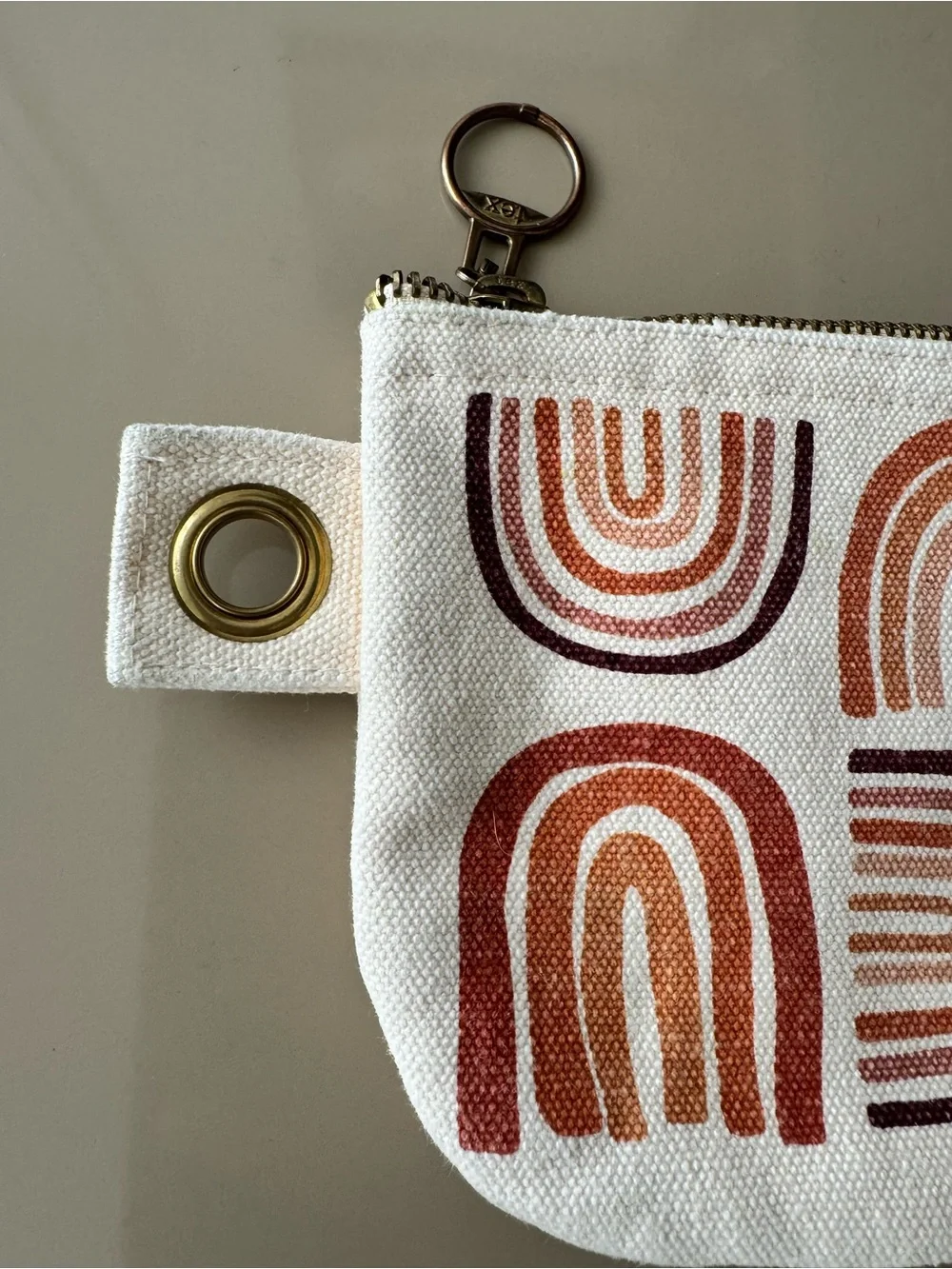 Danica Studio canvas zip pouch with terracotta rainbow screen-print design